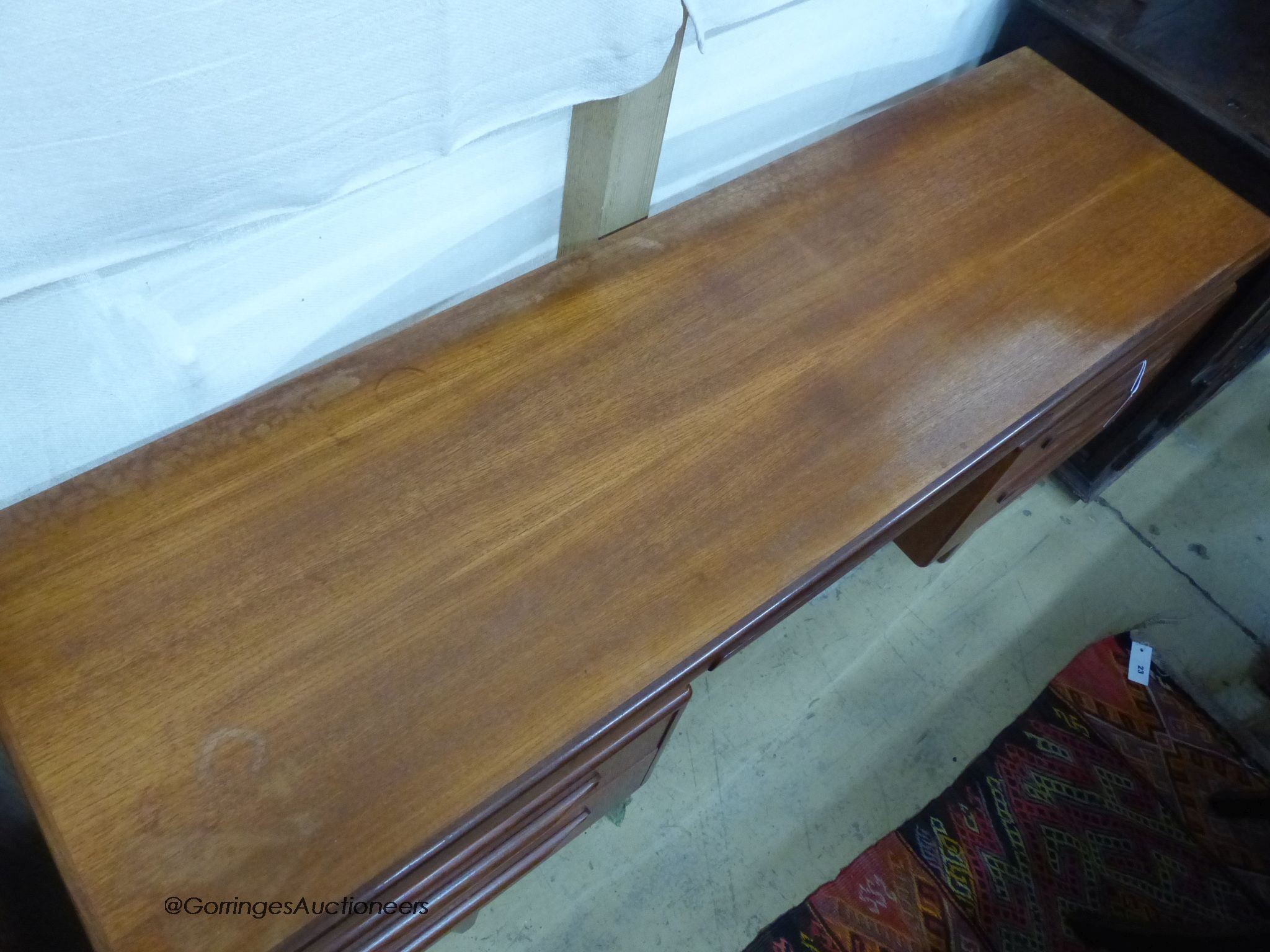 A mid century design G plan teak dressing table, length 152cm, depth 46cm, height 70cm